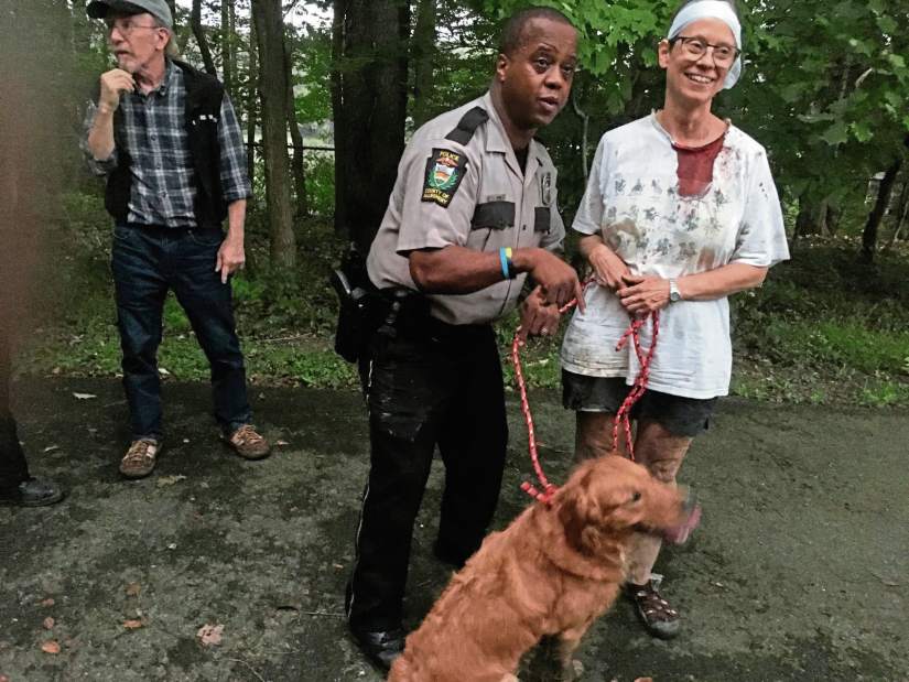 313027vndWomanDogCliffFall100718